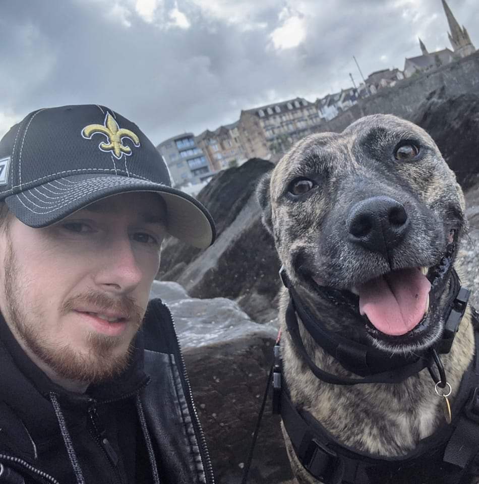 Max Nolan the carpenter and his dog Toby at the beach in Ilfracombe