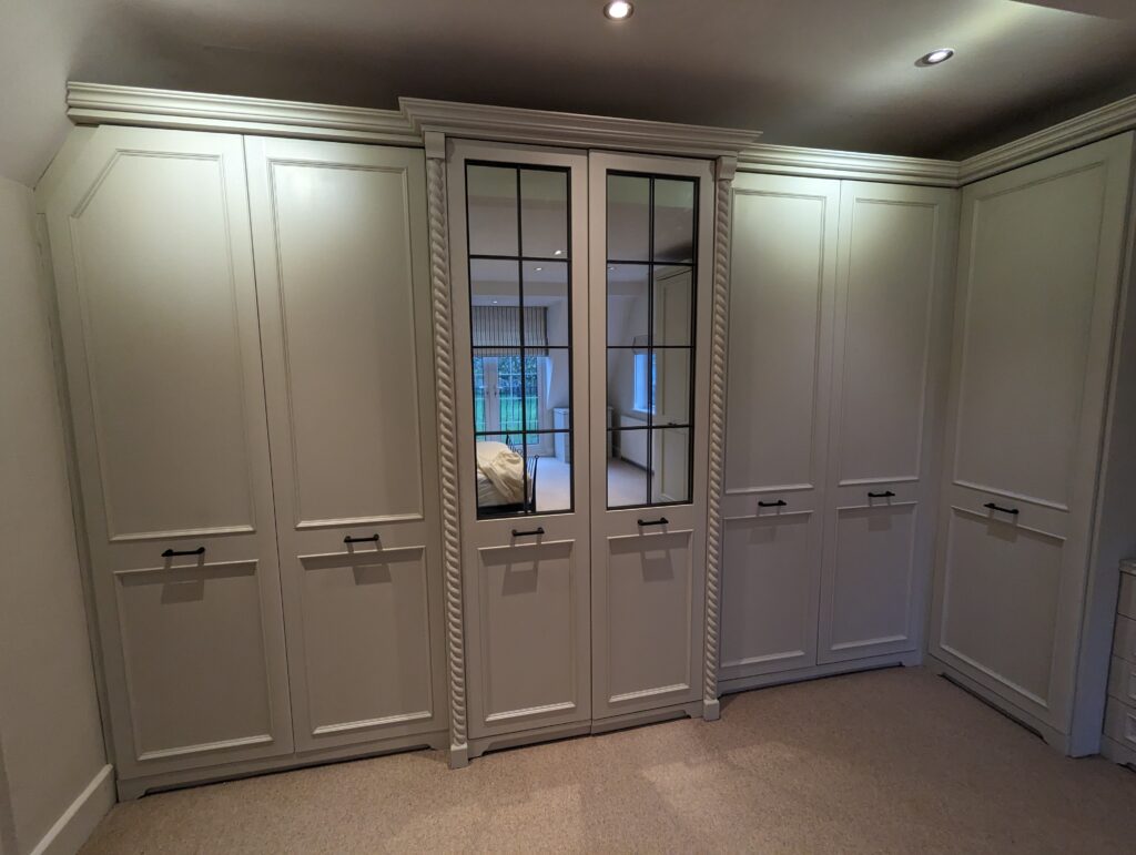 Built in wardrobes with mirrors in the doors restored by MWN Carpentry